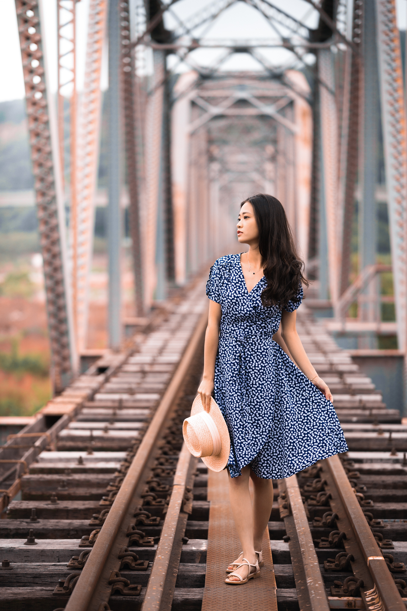 Girl on rail bridge